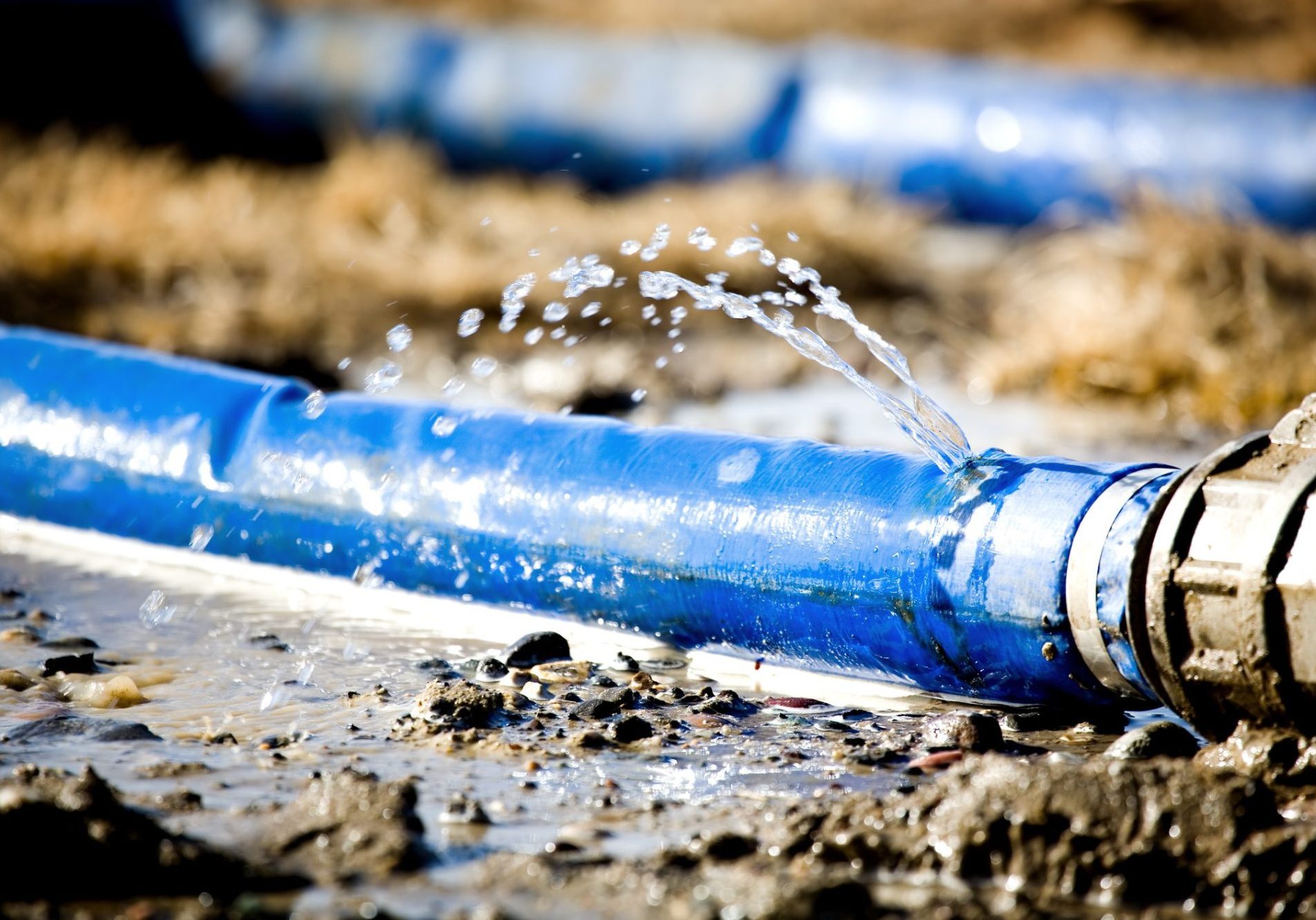 dreamstime_m_2164717 Wasting water - water leaking from a hole in a hose. shallow dof with focus on leak
